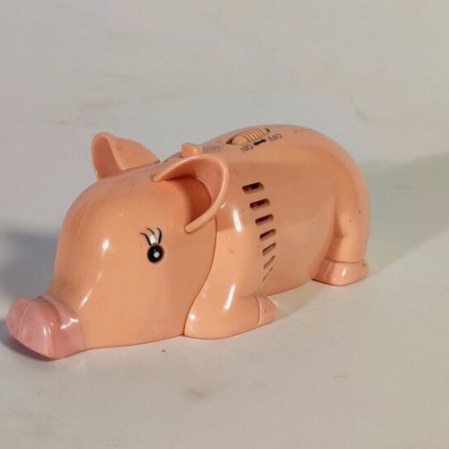 Pig-shaped handheld vacuum cleaner used, functional