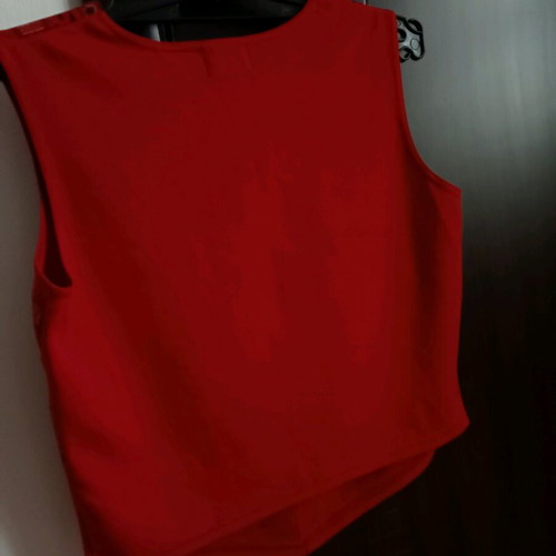 Red sleeveless top with ethnic geometric motifs, like new