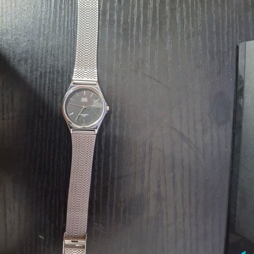 Q&Q Quartz men's watch used, silver with black dial