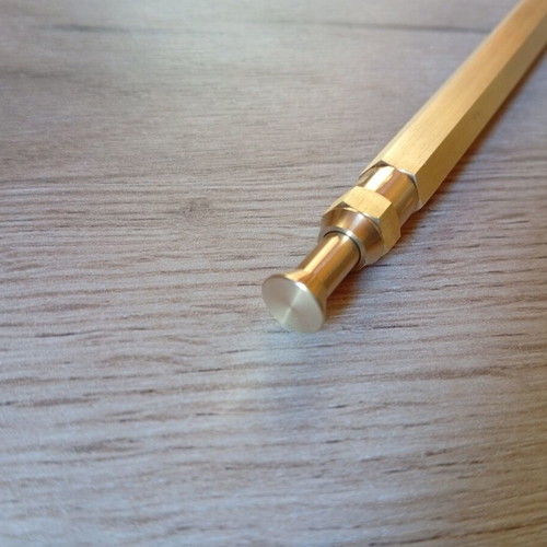 Hexagonal brass pen used, with g2 refill included