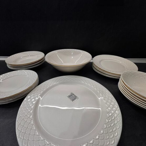Porcelain dinnerware set with embossed design, like new