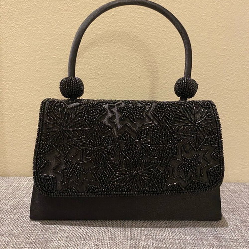 Mini black handbag like new with beaded embossed design