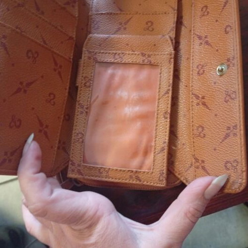 Wallet used camel color with many pockets and minor defect