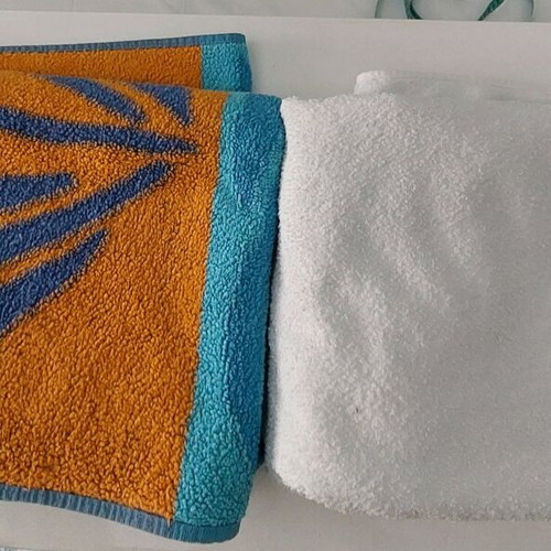 Beach and bath towels like new, 2 large, white and printed