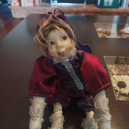Wind-up Pierrot Harlequin doll used with music