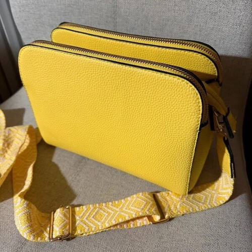 Yellow shoulder bag like new with strap and silver details