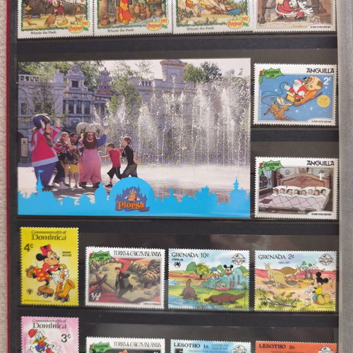 Disney collectible album with 220 stamps and 16 cards