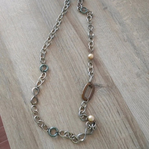 Long necklace chain with decorative elements like new, gold-colored