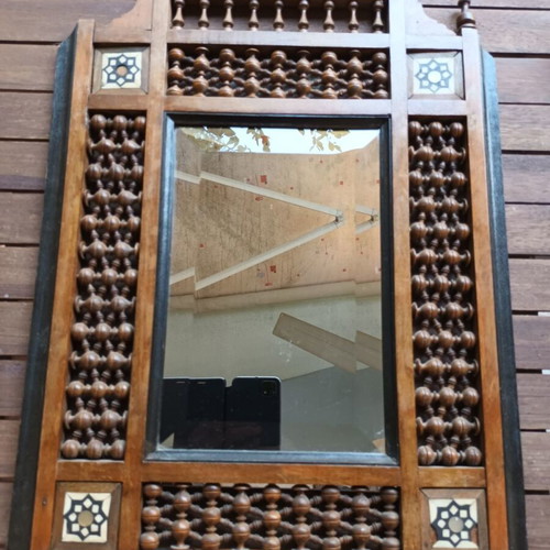 Vintage bijouterie mirror with wooden ornate frame