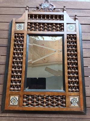 Vintage bijouterie mirror with wooden ornate frame