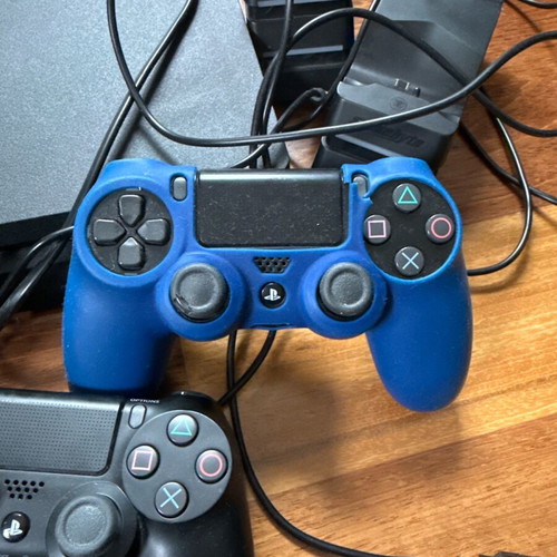 PlayStation 4 (PS4) like new with 2 charging stations, 4 controllers and cables