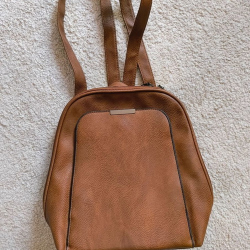 Brown backpack like new with leather texture and two compartments