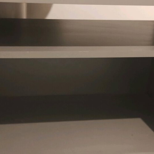 TV stand used, silver color with storage shelf