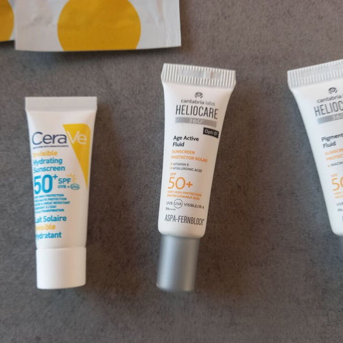 Makeup bag with new sunscreen samples CeraVe Pharmasept Heliocare