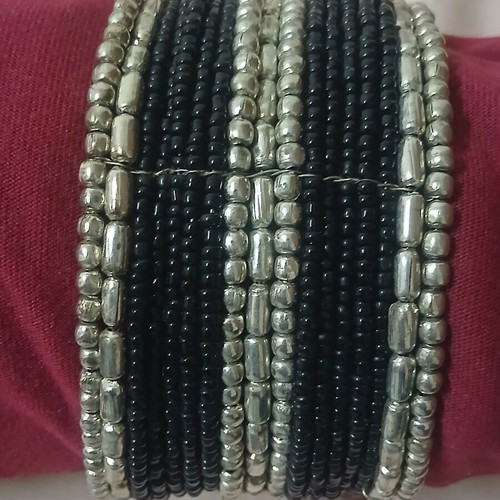 Bracelet with black and silver beads like new, hinged