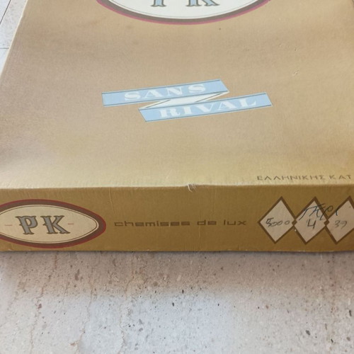 Shirt box used, cardboard with two corner tears on lid