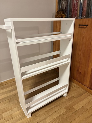 White kitchen shelf unit with adjustable shelf and wheels