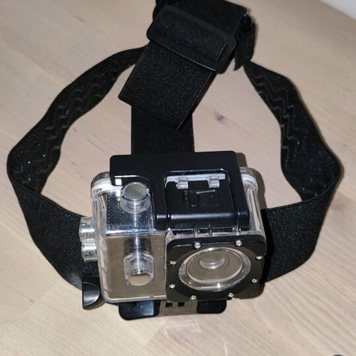 Action camera like new with waterproof case and mounting accessories