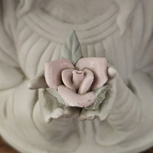 Decorative girl figurine used holding flower