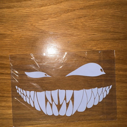 Car sticker with scary smile and eyes, white