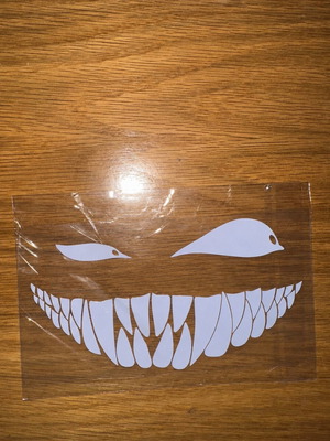 Car sticker with scary smile and eyes, white