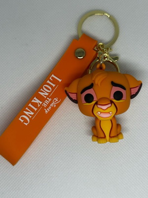 Lion King keychain like new, yellow and orange
