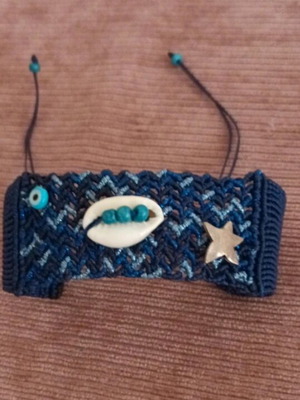 Macrame bracelet like new with shell, silver925 star and blue glass eye