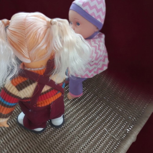 Vintage baby doll set of 2, one with moving legs