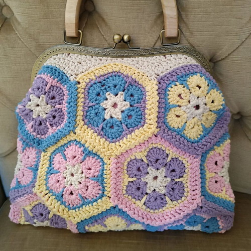 Handmade multicolor knitted handbag with pink lining