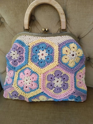 Handmade multicolor knitted handbag with pink lining