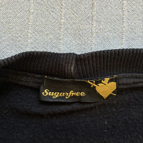 Sugarfree black cropped sweatshirt with balloon sleeves and glitter patches