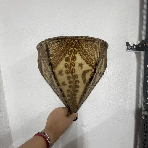 Leather wall sconces like new with Moroccan designs for exotic atmosphere