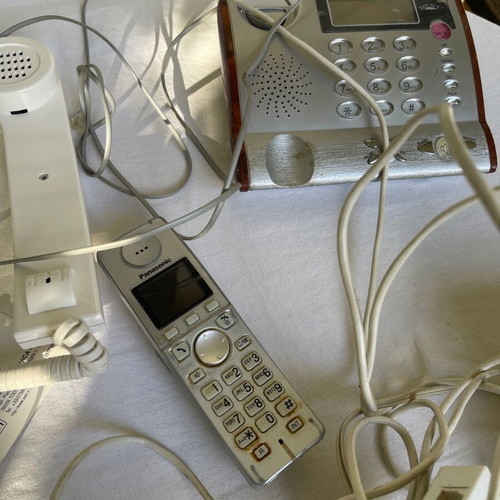 Set of old cables, sockets and telephony devices used