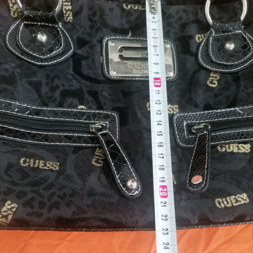 Guess vintage black handheld bag used with silver and gold details
