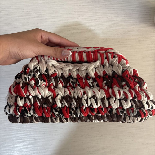 Handmade crochet clutch bag with fabric