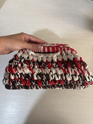 Handmade crochet clutch bag with fabric