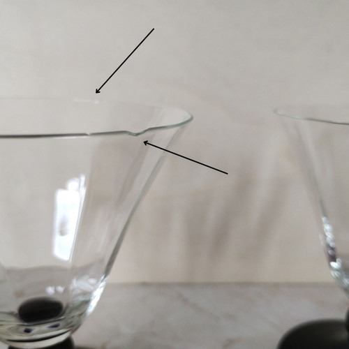 Vintage thin-walled glass glasses with black stem used, retro style