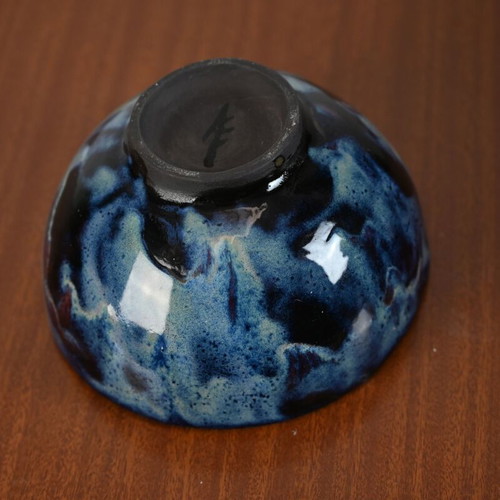 Ceramic bowl used with blue glazed surface