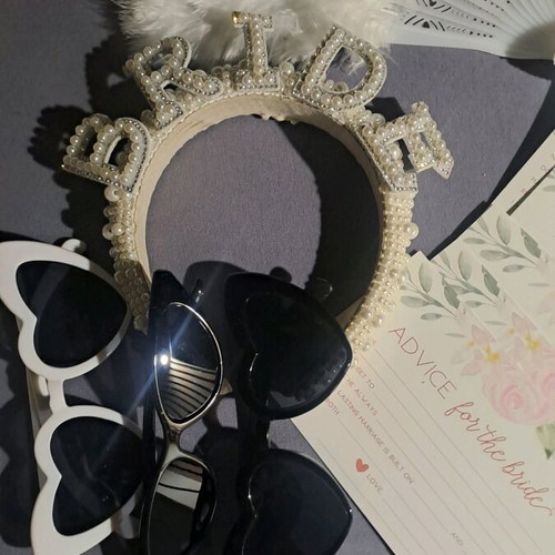 Bachelor accessories used, women's hair, fan, glasses