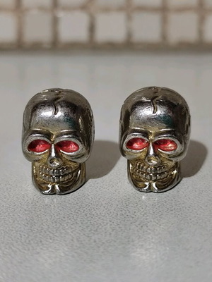 Bicycle valve caps new, skull shape with red eyes