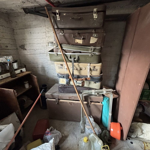 Vintage suitcases and large wooden trunk