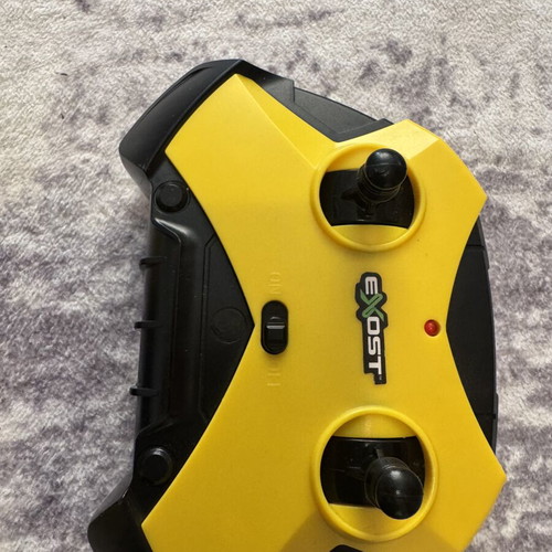 Exost 360 Cross remote control car used with yellow off-road wheels
