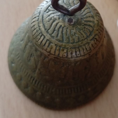 Vintage brass bell with embossed geometric designs like new