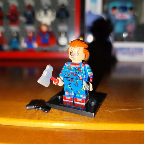 Chucky like new with stand, axe, knife, pistol