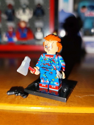 Chucky like new with stand, axe, knife, pistol