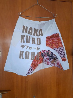 Trendy asymmetrical skirt with gold print and floral patchwork like new