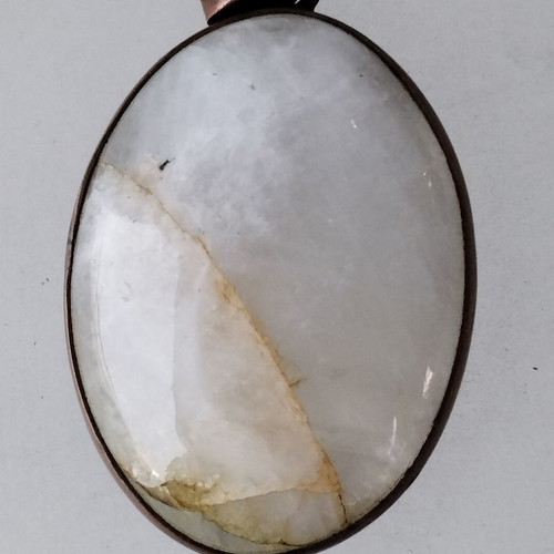 Metal necklace with oval moonstone semi-precious stone used