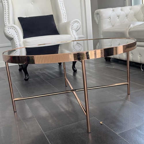 Round coffee table with glass top and metal frame