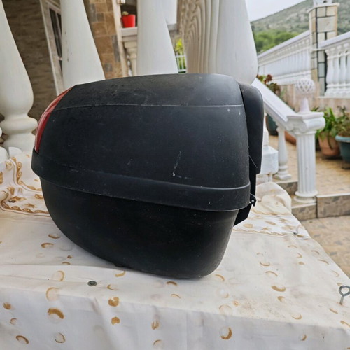 Large motorcycle top case used with key and passenger cushion