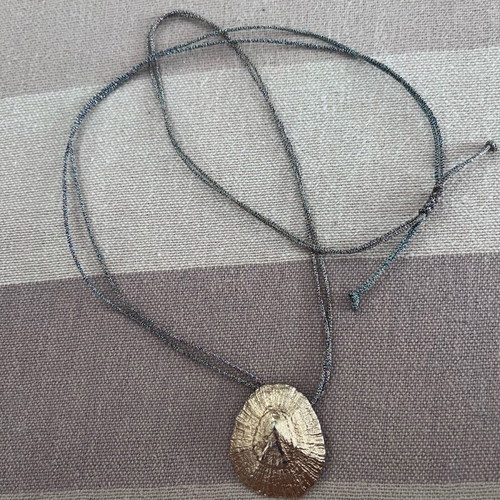 Long cord necklace adjustable, like new, metallic gold color